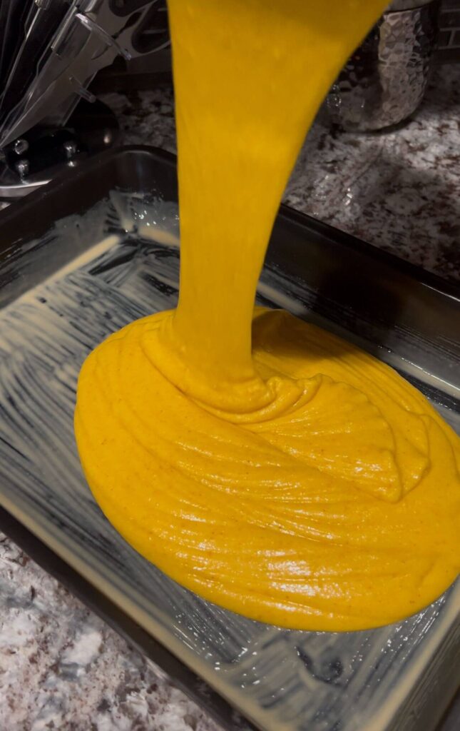 Pouring the  cake mixture to the Metallic Tray