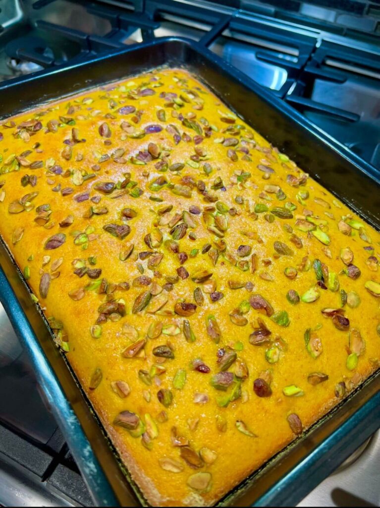 Freshly baked Sfouf turmeric cake just removed from the oven, golden and moist.