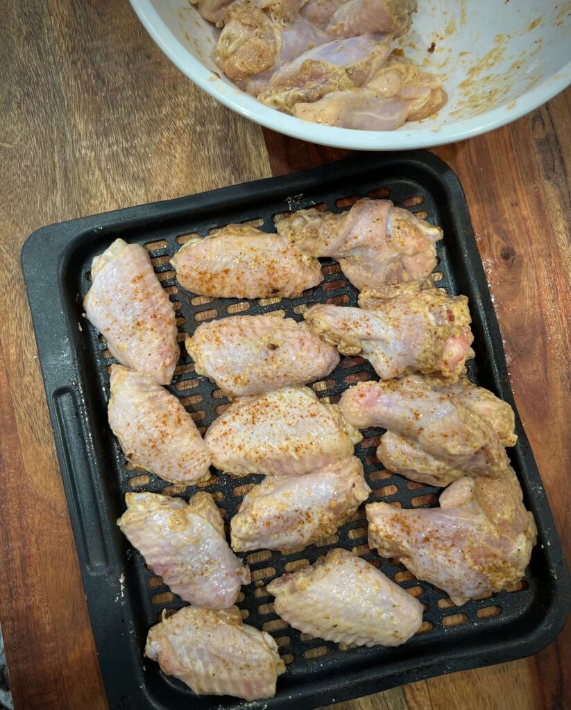 spray a baking tray with oil. Line the chicken  on the tray, 