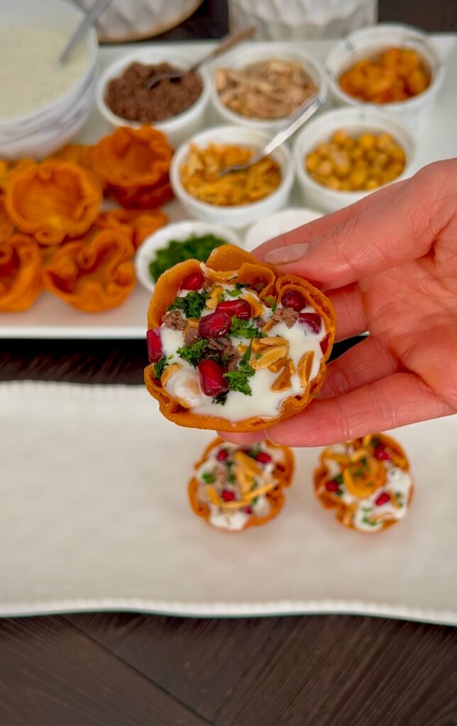 Mini Fatteh cups with chickpeas, beef, shrimp, yogurt sauce, and toppings