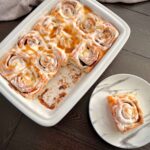 Freshly baked cinnamon rolls topped with icing.