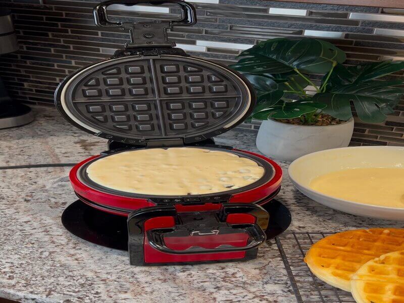 : Pancake batter cooking in the pan.
