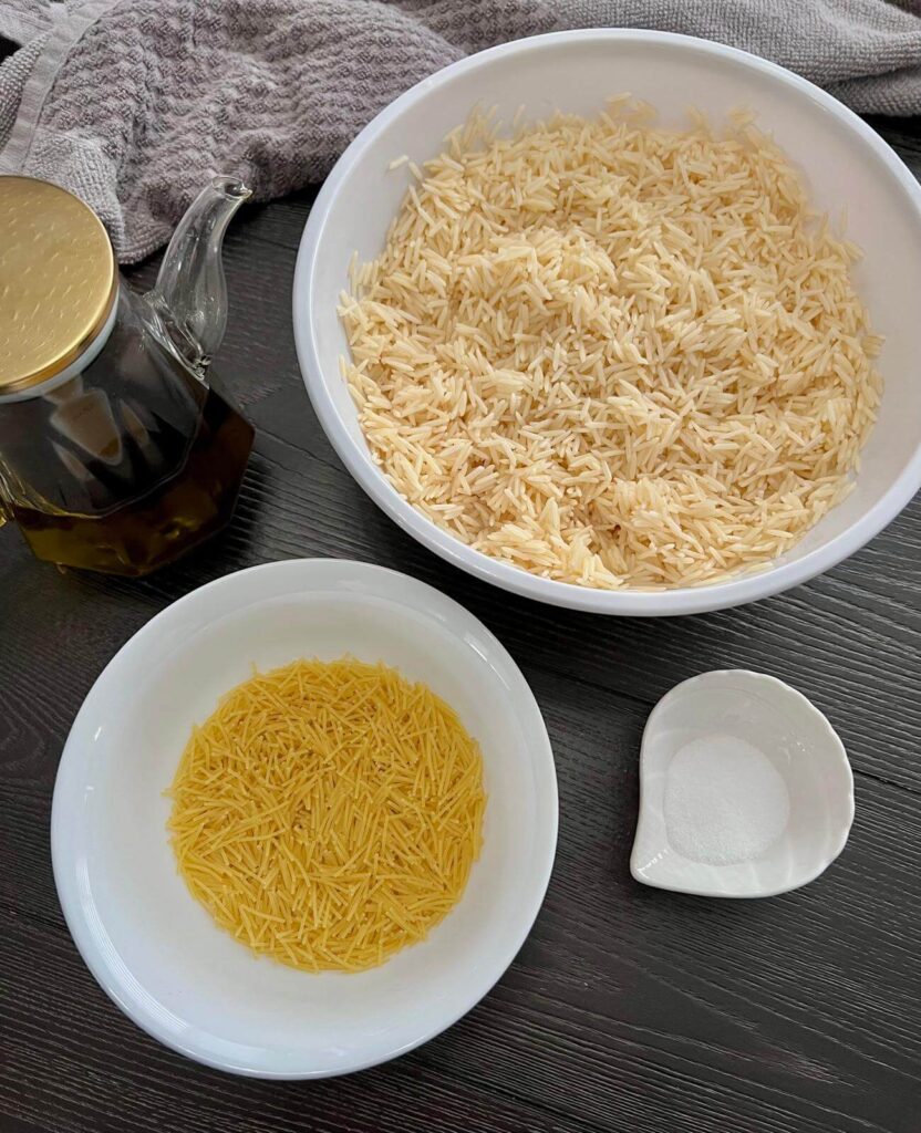 Ingredients for Lebanese rice with vermicelli, including basmati rice, vermicelli noodles, olive oil, salt, and hot water