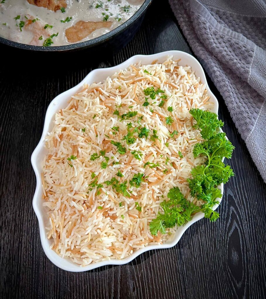 A serving of Lebanese rice with vermicelli, featuring fluffy rice and golden toasted noodles.