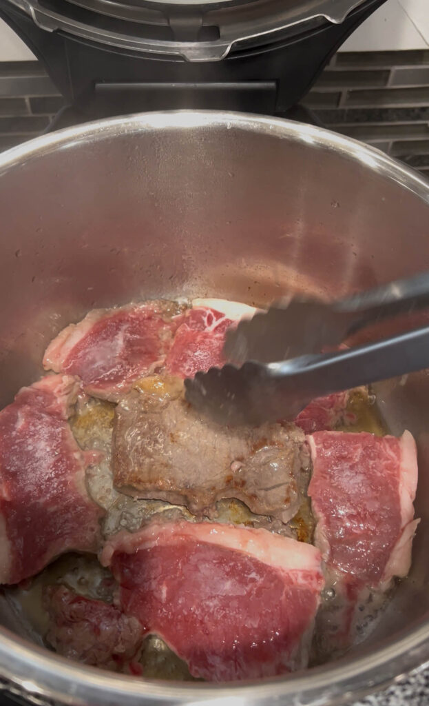 Brown the meat then add in the bottom of the pot