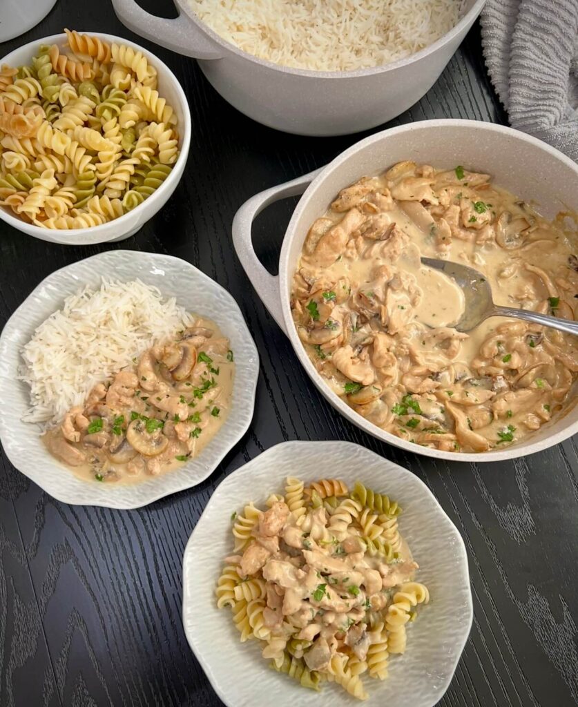 Serving Chicken stroganoff with white rice and pasta 