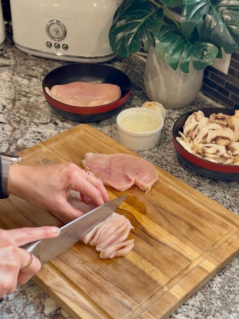 Cutting the chicken for the Chicken stroganoff