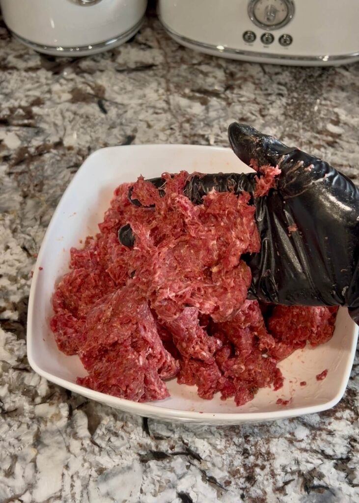 Mixing meat with spices,  yogurt and oil to make homemade doner kebab 